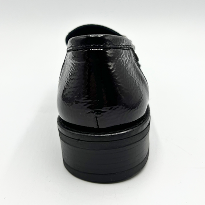 Navy patent leather dress shoe on a white background