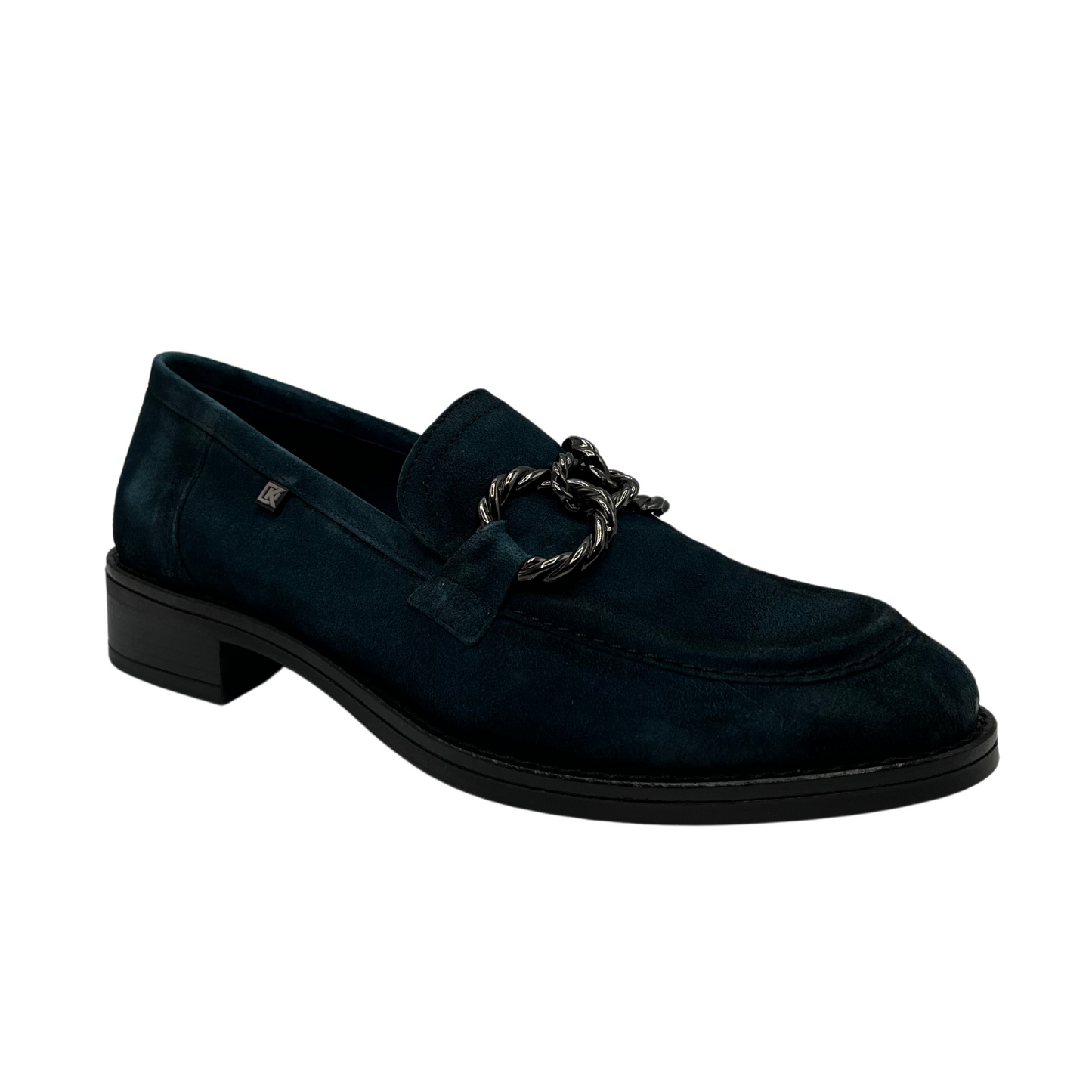 45 degree angled view of blue suede loafer with short block heel and metal embellishment on the upper