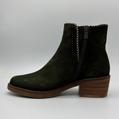 A dark olive blue suede ankle boot with a block heel shown against a light gray background.