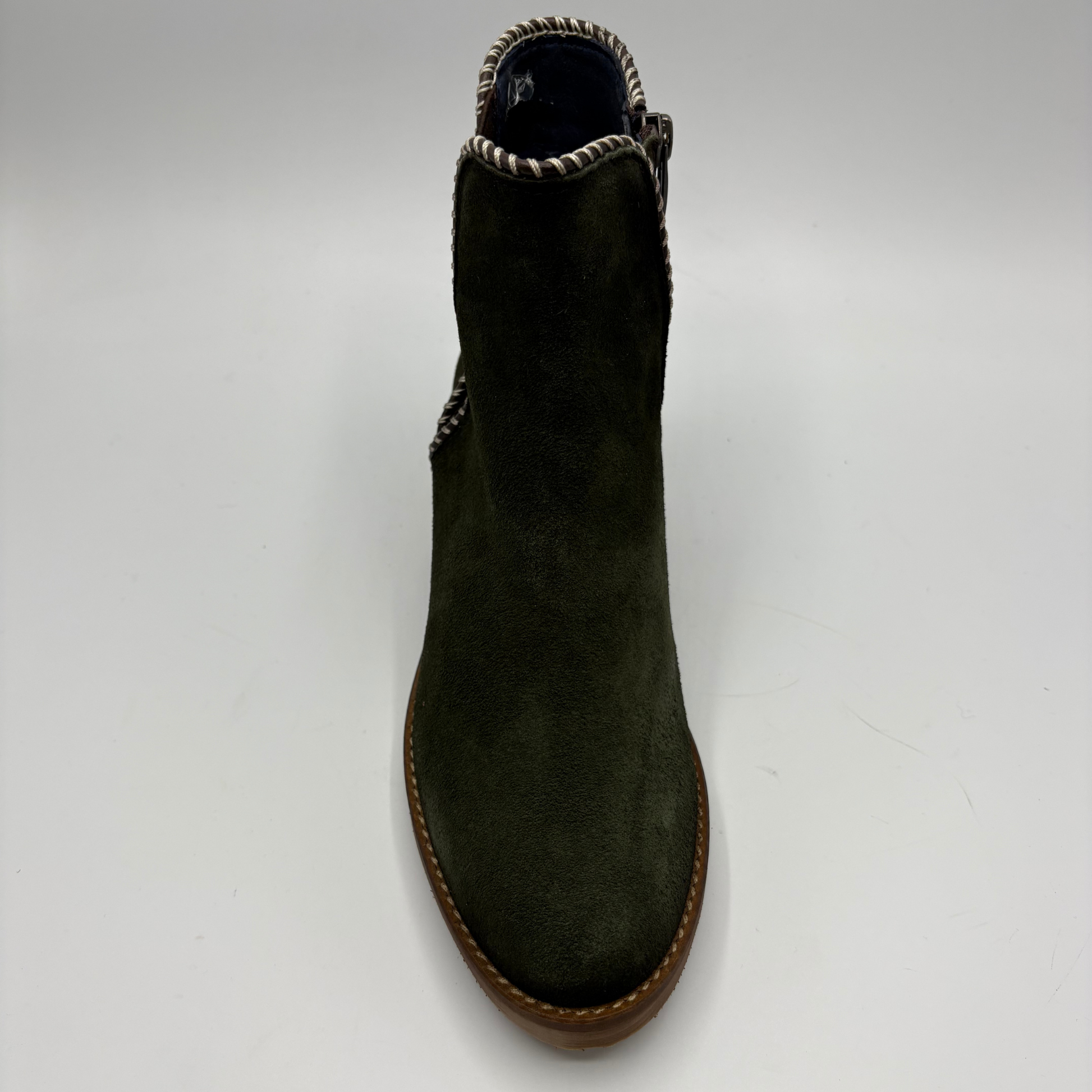 An olive green suede ankle boot with a brown sole and a decorative braided trim around the collar, shown from a top-down view on a white background.
