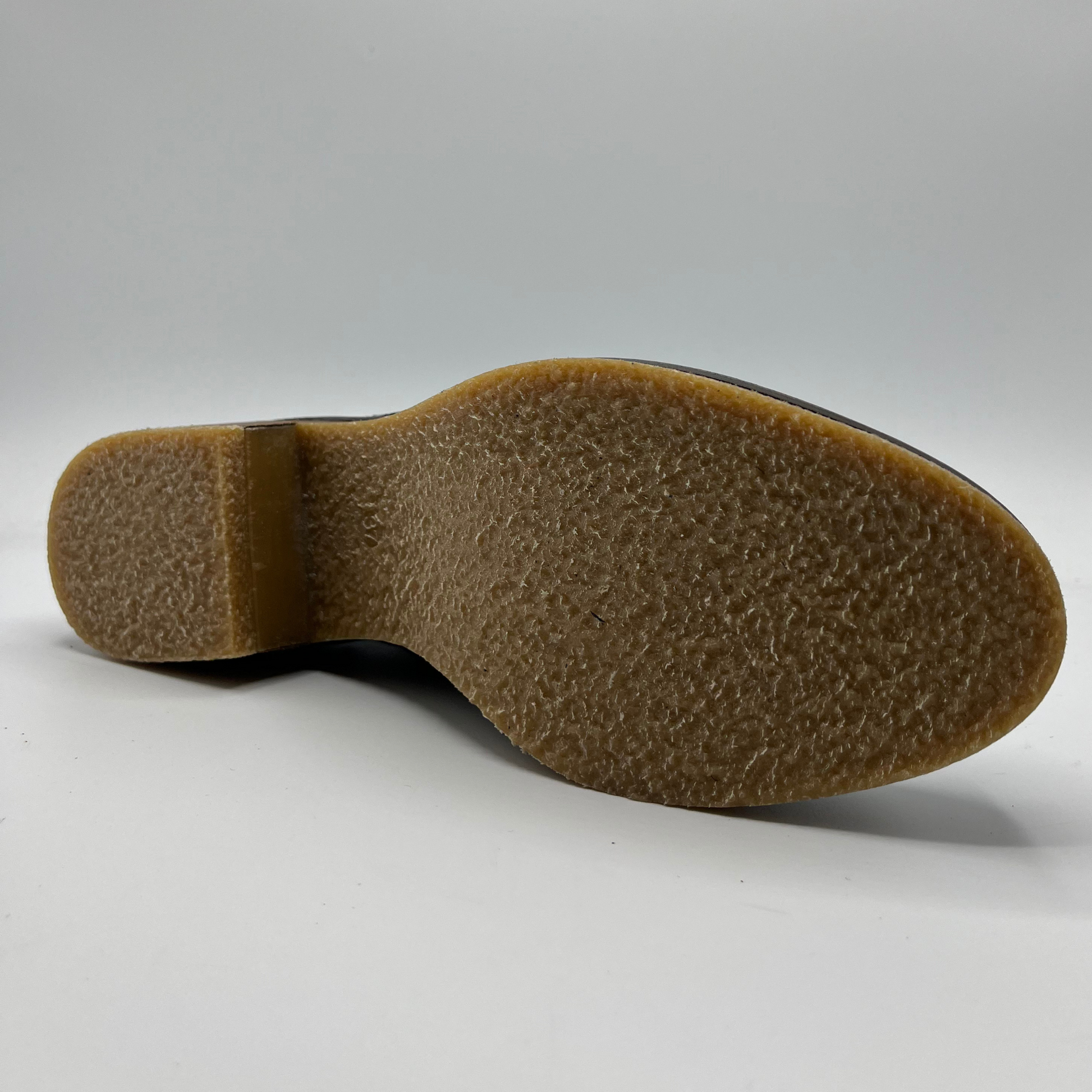 Brown shoe sole on a white background