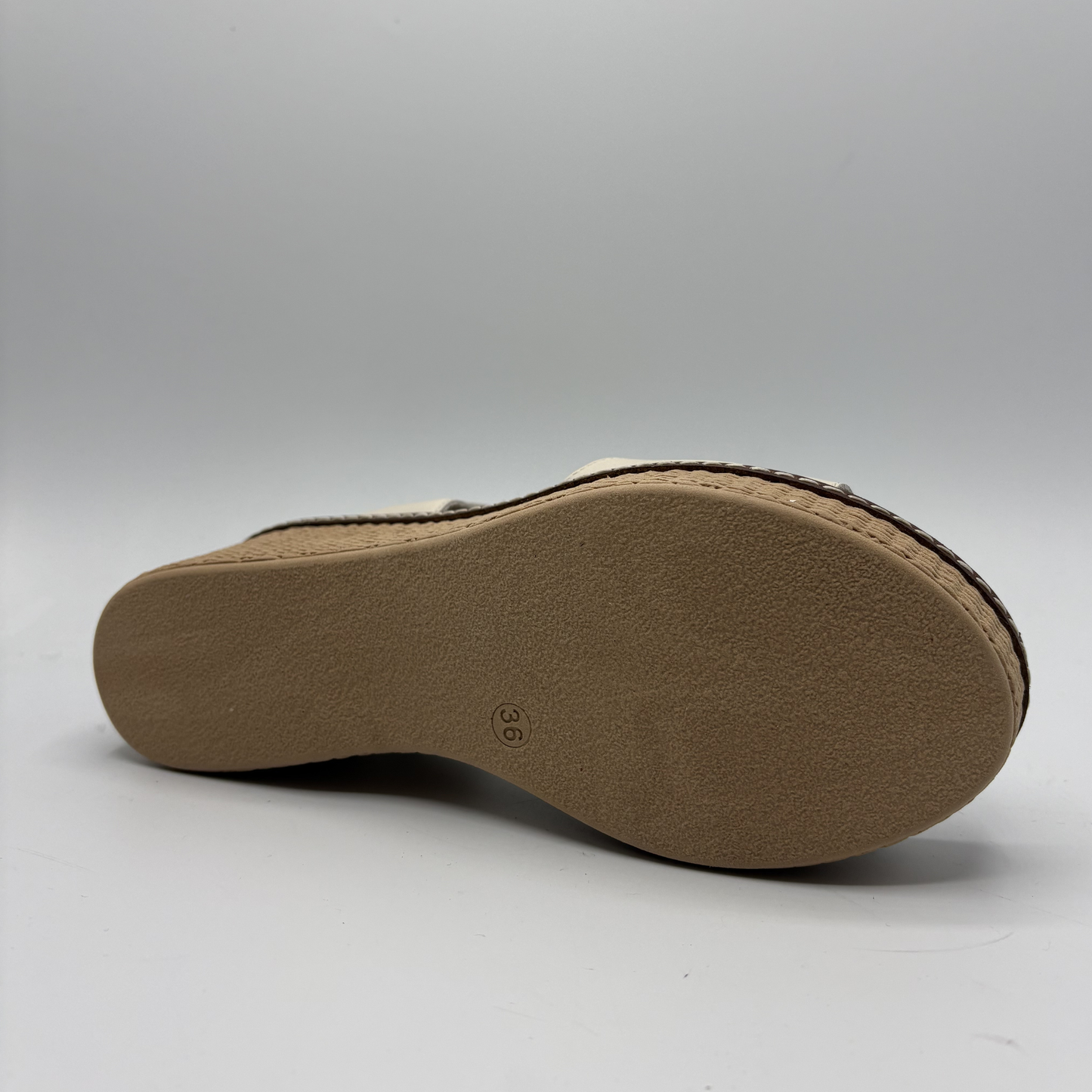 Brown sandal sole on a light gray background
