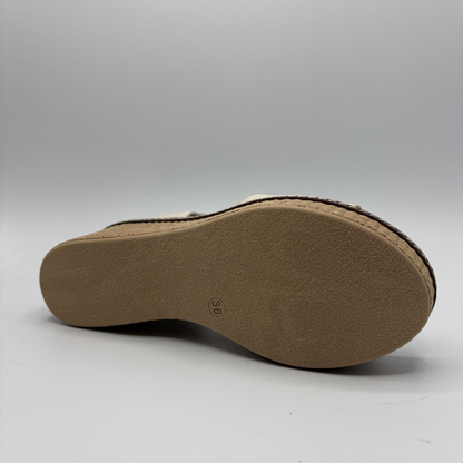 Brown sandal sole on a light gray background