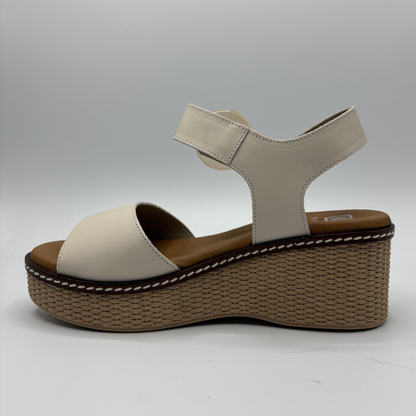 Beige sandal with a brown platform on a white background