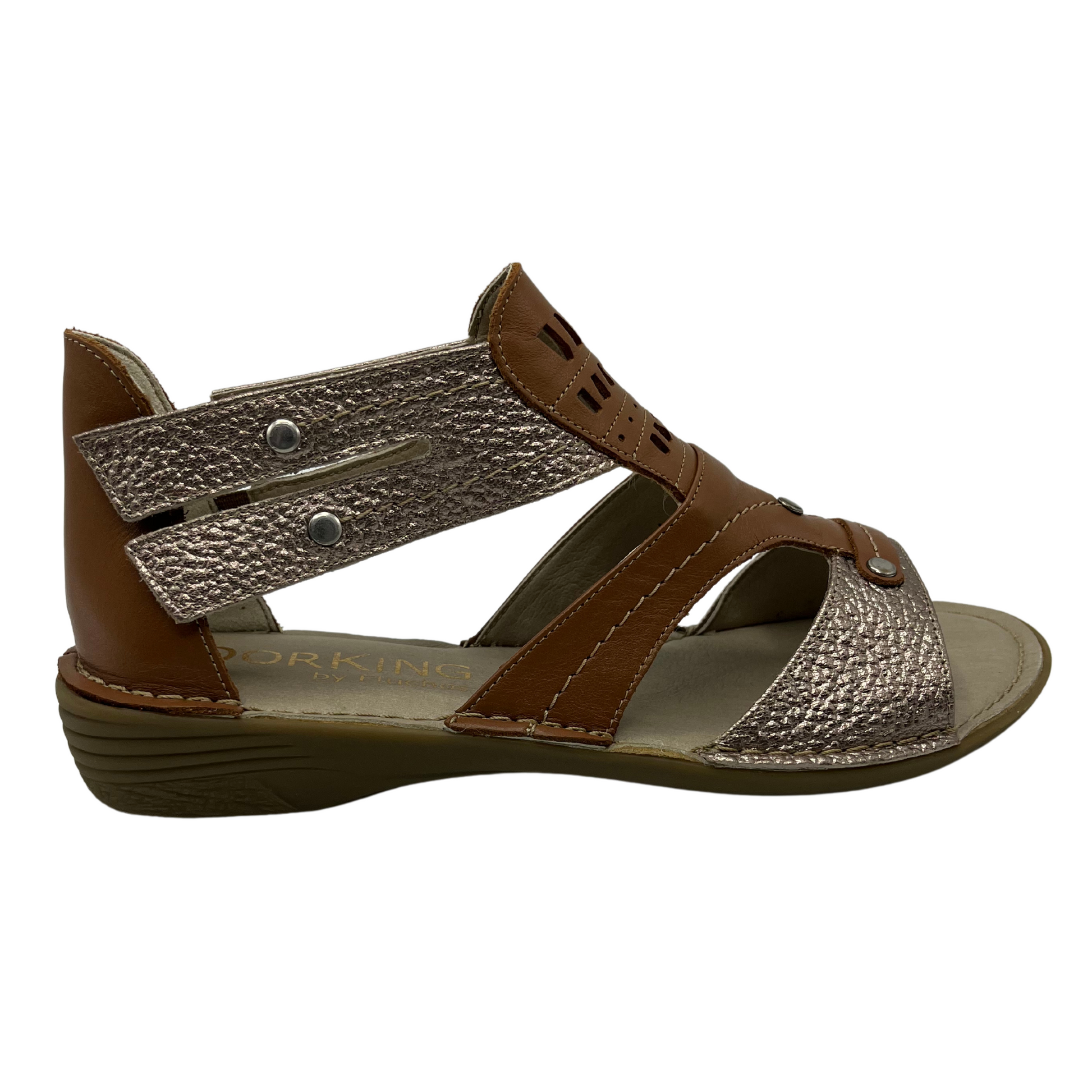 Right facing view of brown and metallic leather strapped sandal with rubber outsole