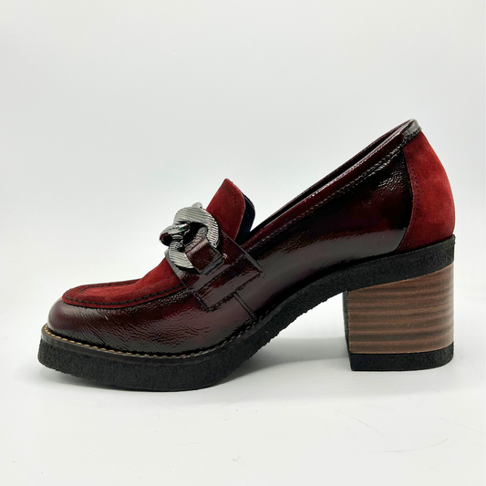 Red and brown loafer shoe on a white background