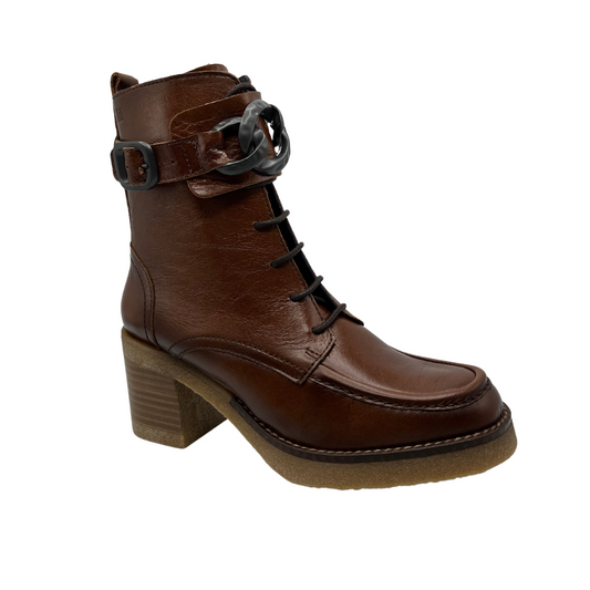 45 degree angled view of brown leather short boots with a chunky block heel, rounded toe and both lace up front with side zipper closure