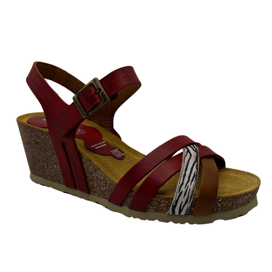 45 degree angled view of leather strapped wedge sandals with cork footbed