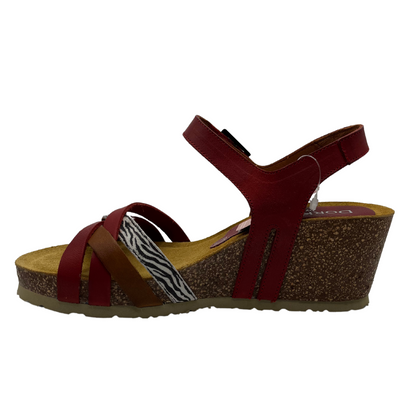 Left facing view of brown and metallic leather strapped sandal with rubber outsole