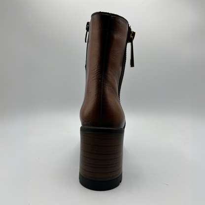 Brown ankle boot on a white background