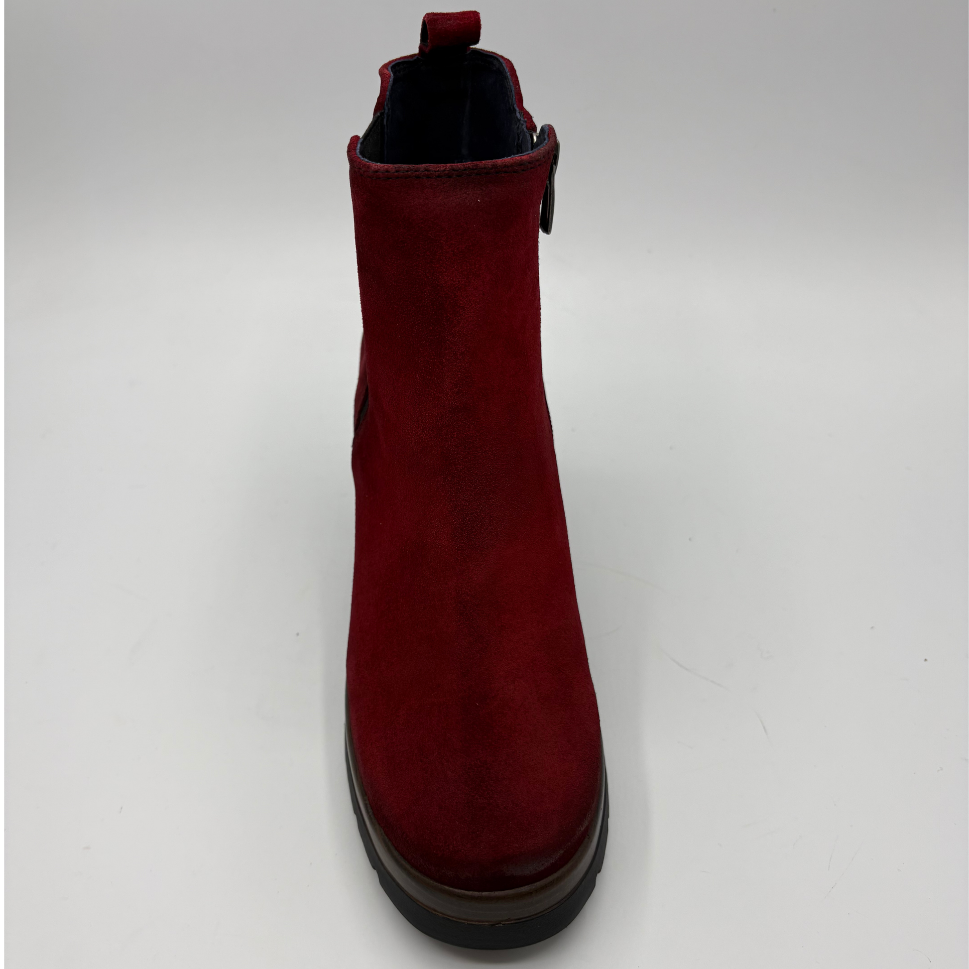 A single dark red suede Chelsea-style ankle boot with a black sole, shown from a front-facing perspective on a light gray background.