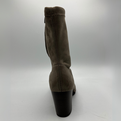 Taupe boot with a black heel on a white background