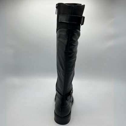 Black knee-high boot with buckles on a gray background
