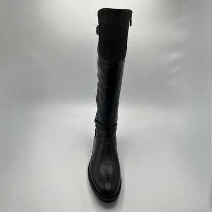 Black knee-high boot on a light gray background