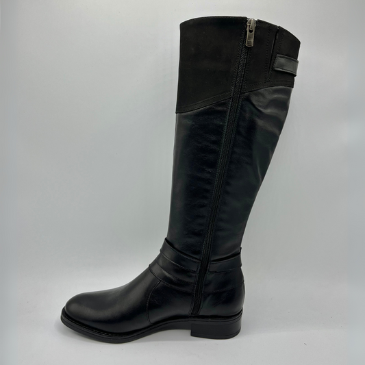 Black knee-high boot on a gray background