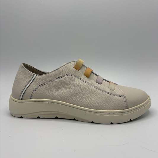 Beige sneaker on a gray background