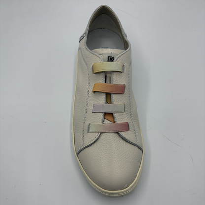 Beige sneaker with multicolored laces on a light gray background