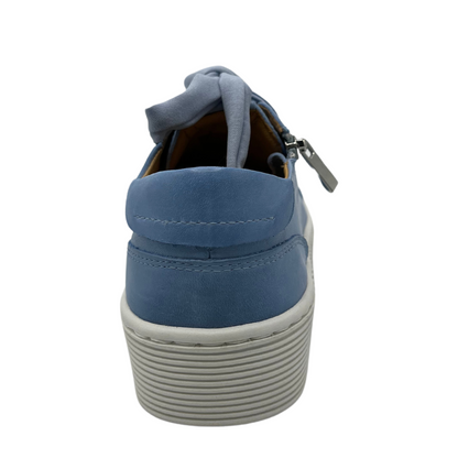 Back view of blue leather sneaker with matching laces and white rubber outsole