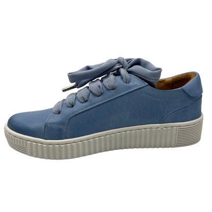 Left facing view of blue leather sneaker with matching laces and white rubber outsole