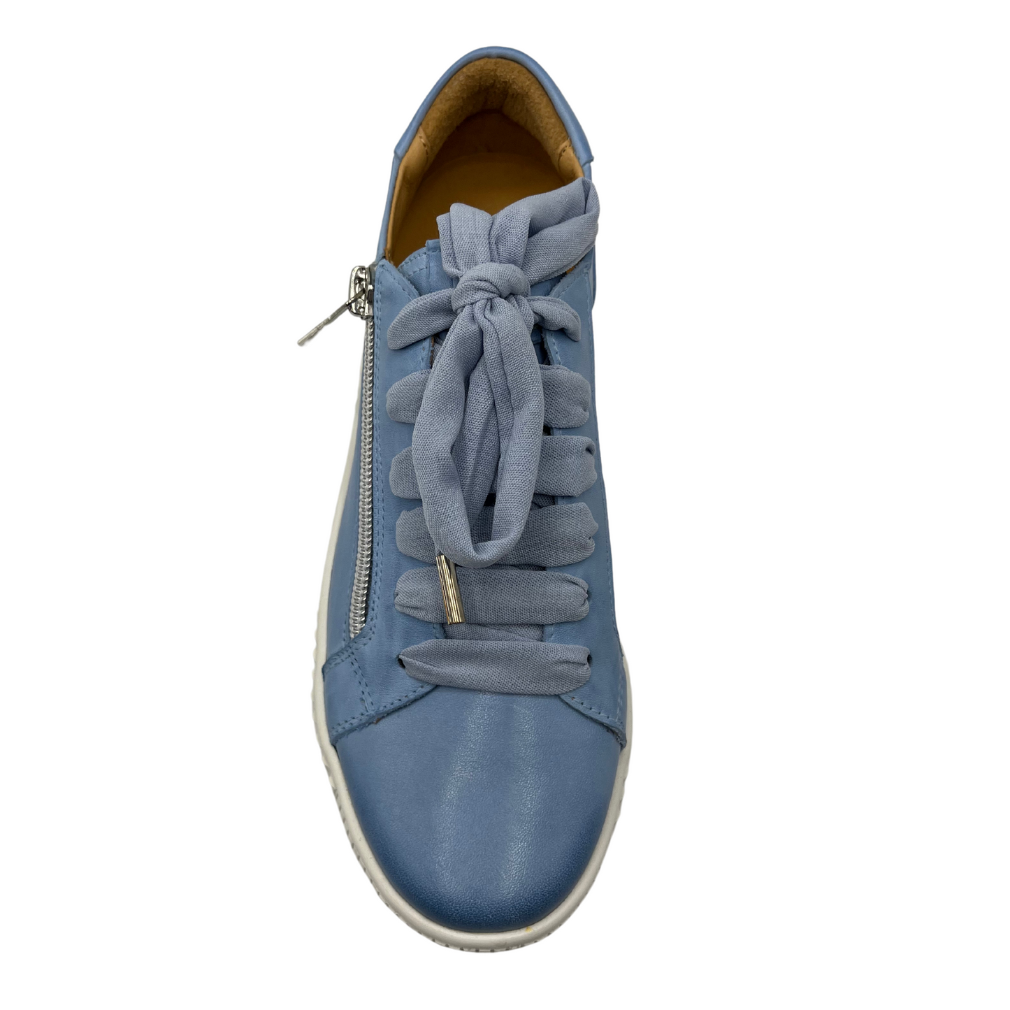 Top view of blue leather sneaker with white rubber outsole