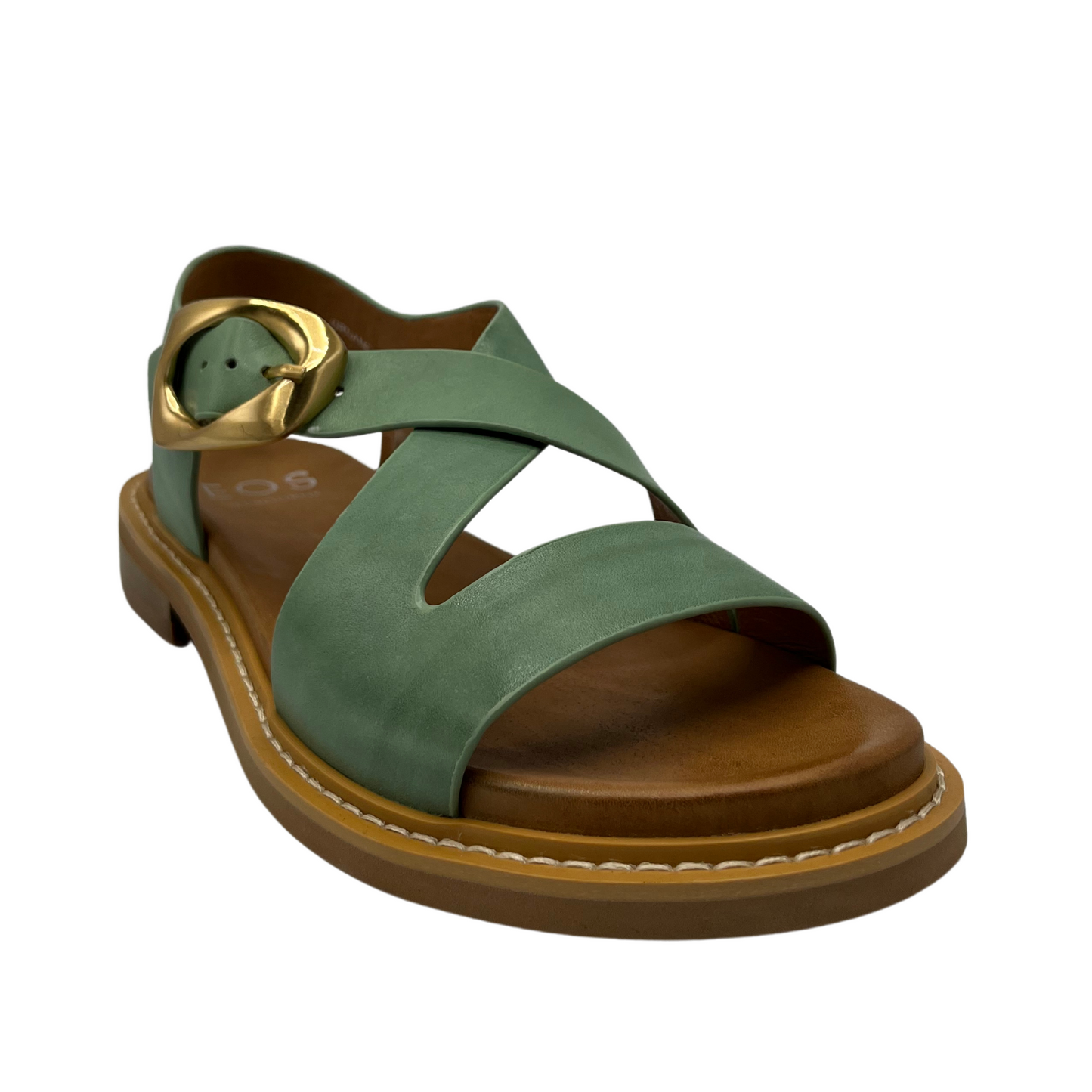 45 degree angled view of basil coloured leather sandals with gold pin buckle closure and low heel