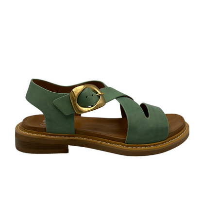 Right facing view of basil green leather sandals with pin buckle closure and low heel