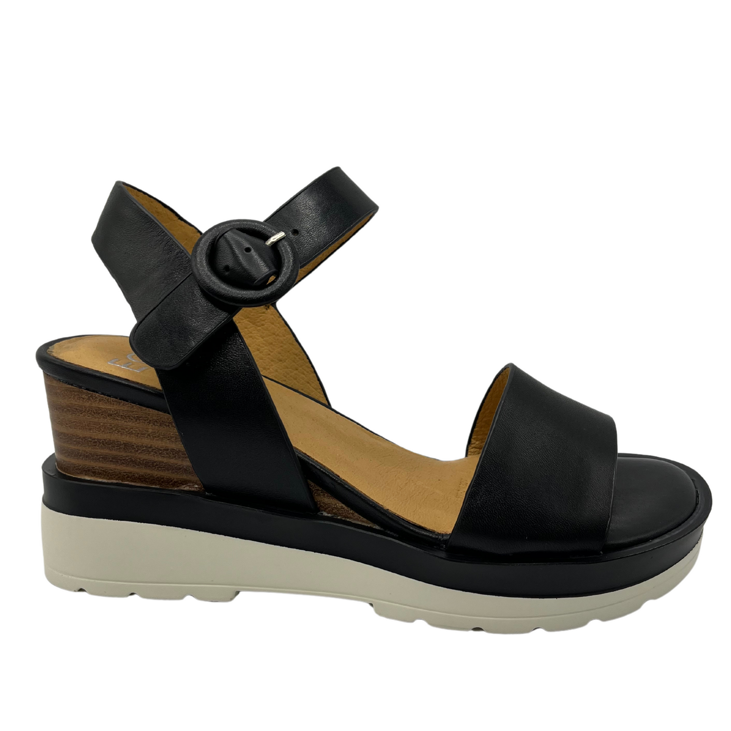 Right facing view of black leather sandal with stacked wedge heel