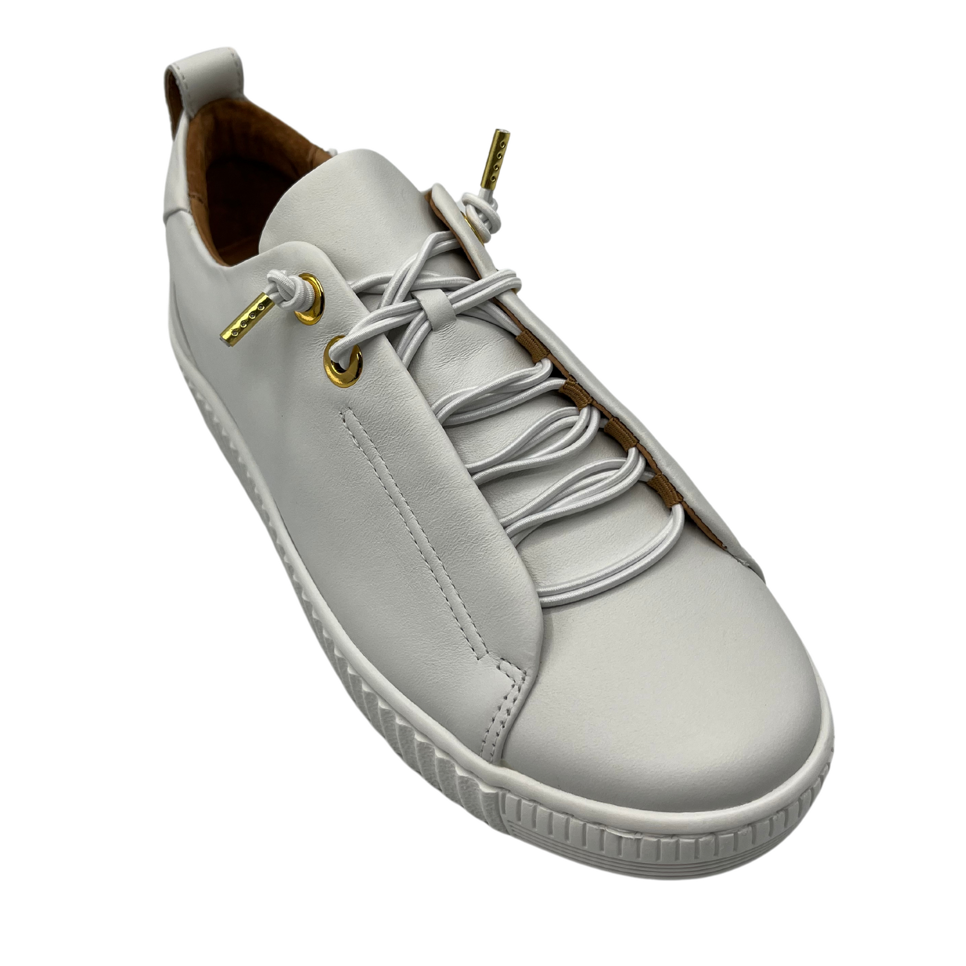 45 degree angled view of white leather sneaker with matching laces with white rubber outsole