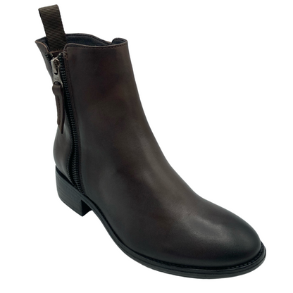 45 degree angled view of brown leather ankle boots with zipper closure and rounded toe