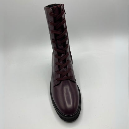 Dark brown leather boot with laces on a light gray background