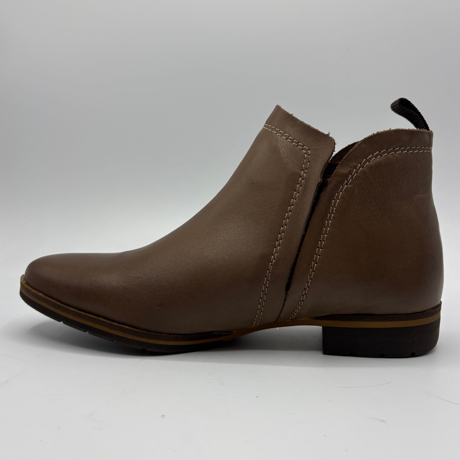 A single brown leather ankle boot with a side zipper, shown in profile against a light gray background.