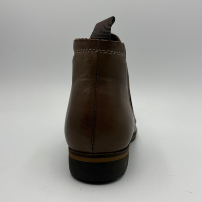 A dark brown leather ankle boot shown from the back, featuring a pull tab, contrast stitching, and a black sole with a tan stripe.