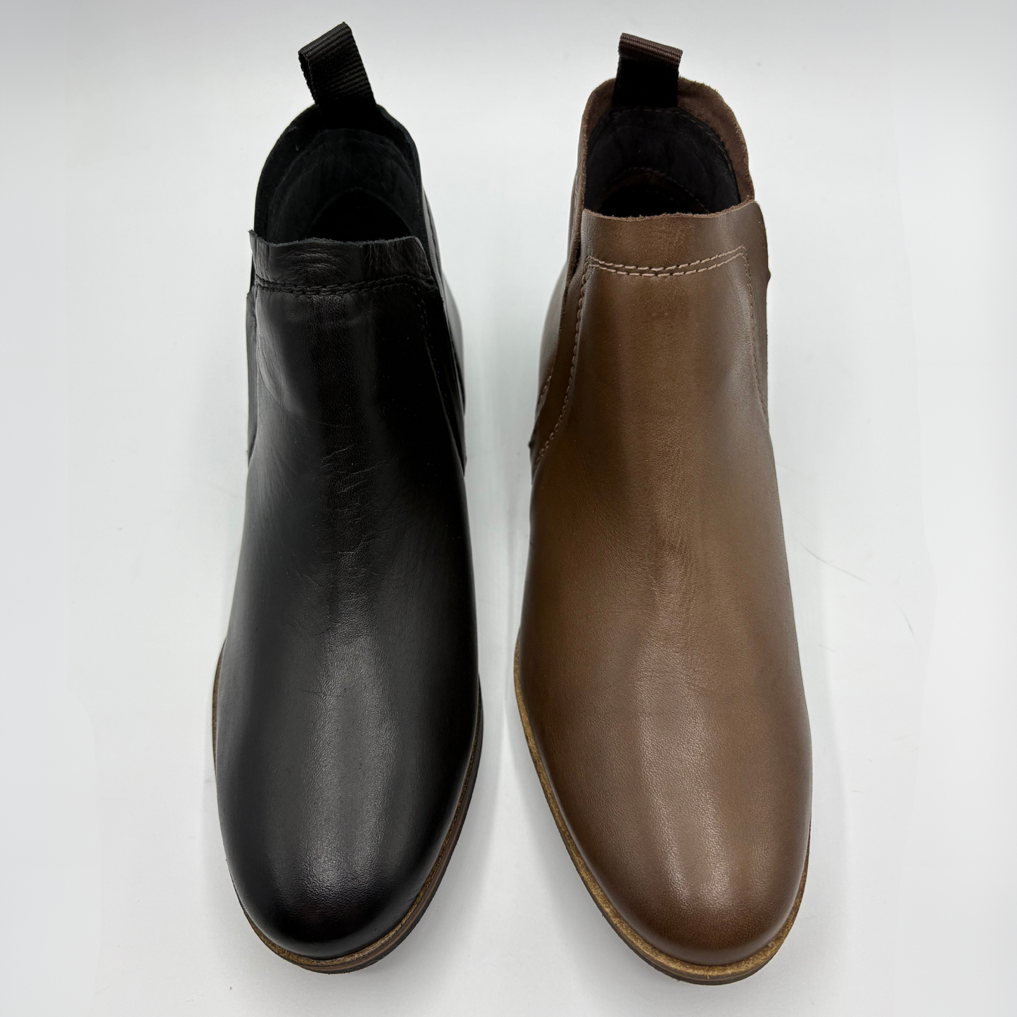 A pair of Chelsea-style ankle boots shown side by side on a plain white background, one in black leather and the other in brown leather.