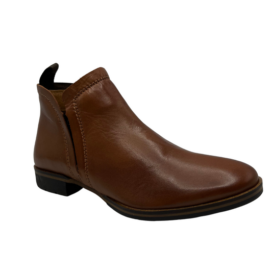 Right facing view of brandy coloured leather ankle boot with hidden elastic side gores, pull on heel tab, and short block heel
