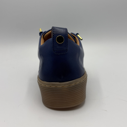 Navy blue shoe with brown sole on a white background