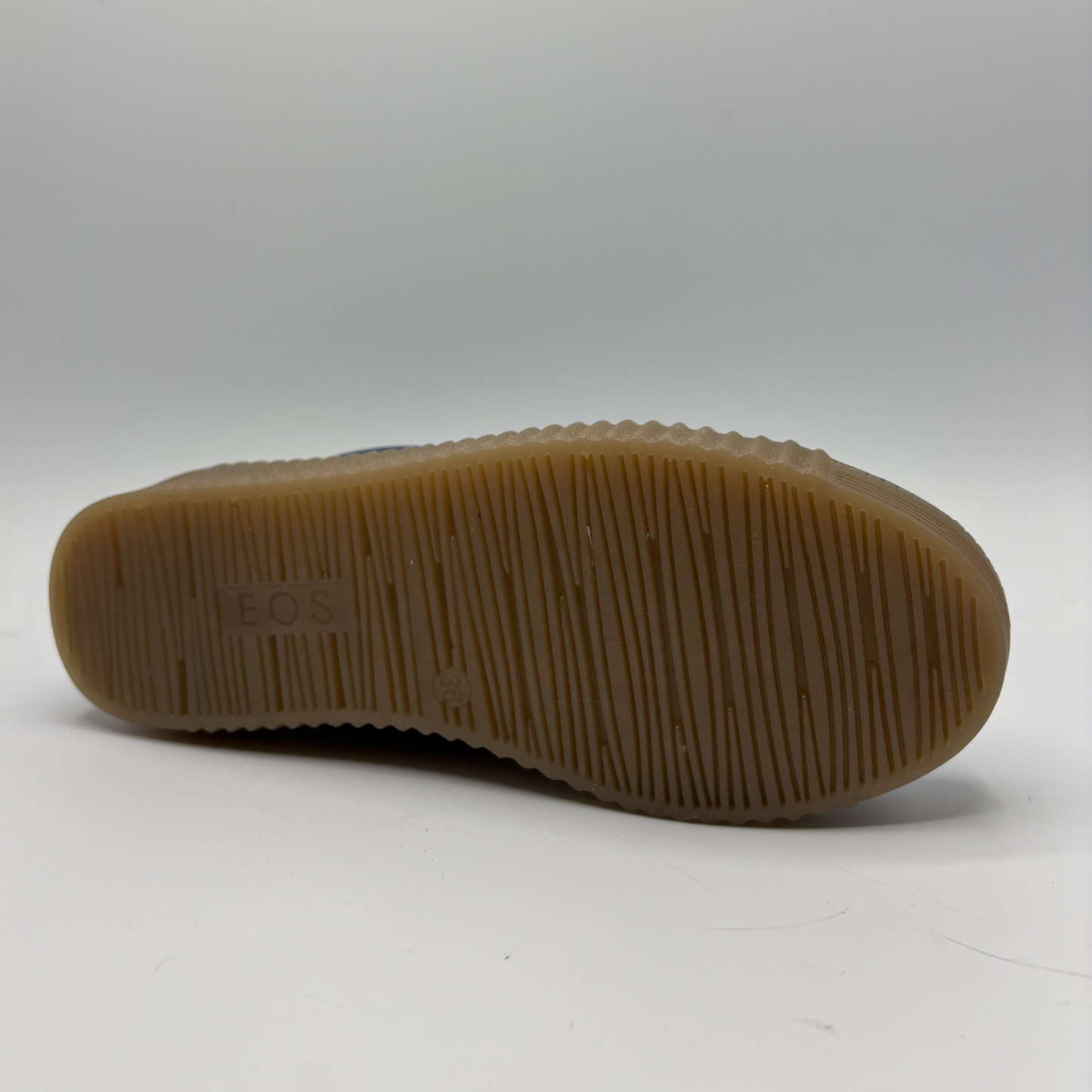 Brown sole of a shoe with 'BOS' branding on a white background