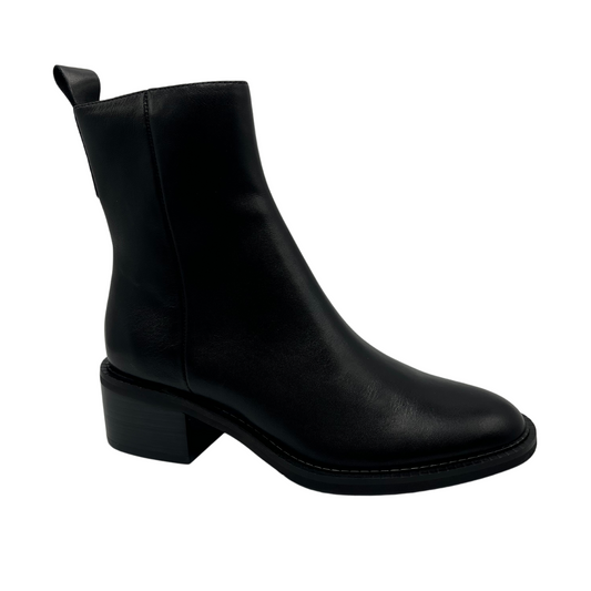 45 degree angled view of black leather short ankle boots, short block heel and pull on heel tab