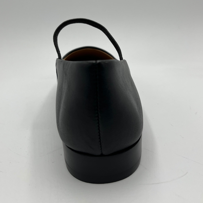 Black leather shoe on a white background