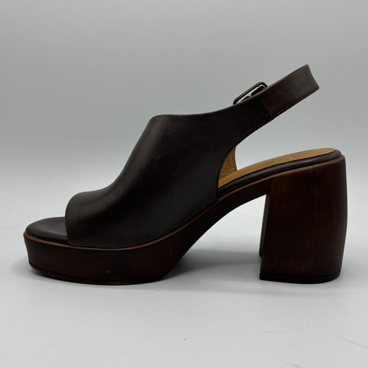 Black sandal with wooden heel on a gray background