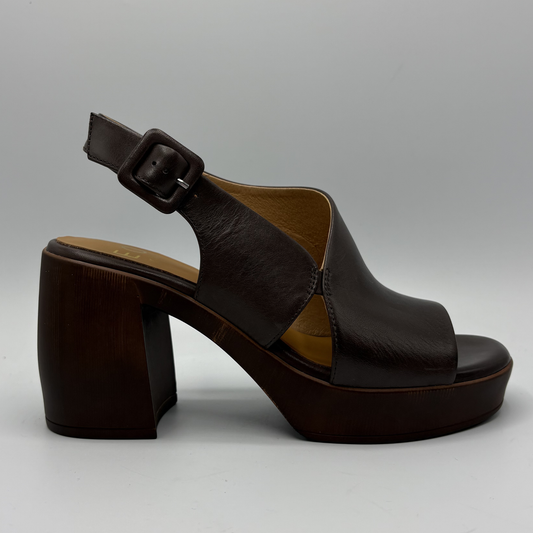 Brown platform sandal with a block heel on a gray background