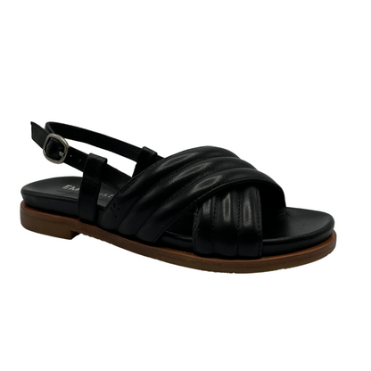 45 degree angled view of black leather sandal with padded cross over straps and sling back buckle strap