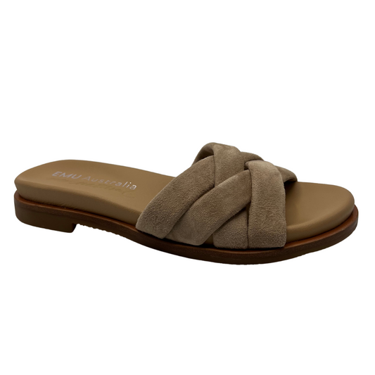 45 degree angled view of taupe suede slip on sandal with padded upper and footbed. Cross strap design and low heel.