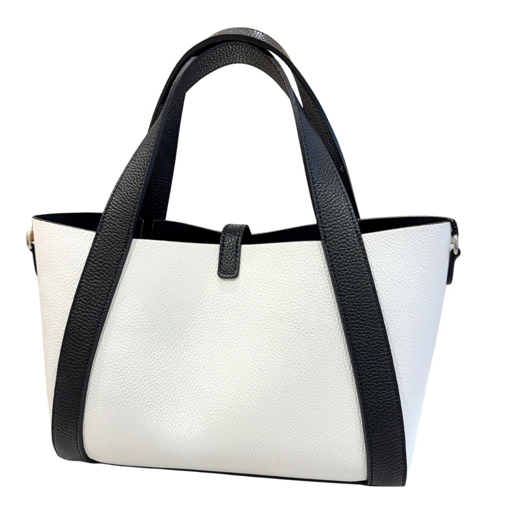 White handbag with black handles and trim on a white background