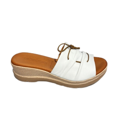 White sandal with brown sole on a white background