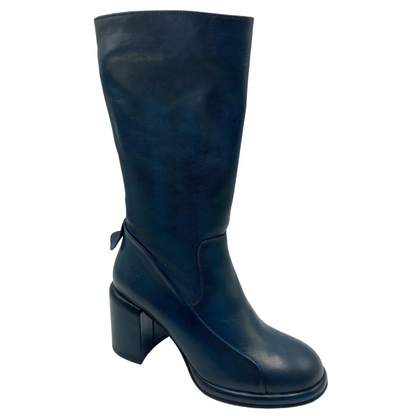 45 degree view of blue leather calf-height boot with a chunky heel. 