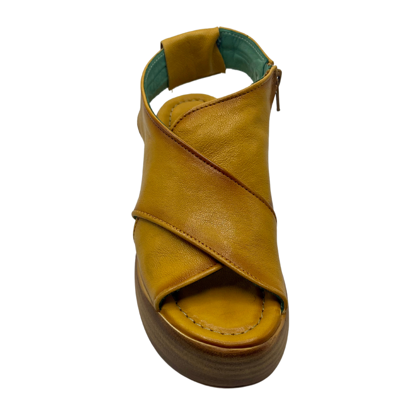 Top view of mustard coloured leather sandals with chunky wedge sole and sling back strap