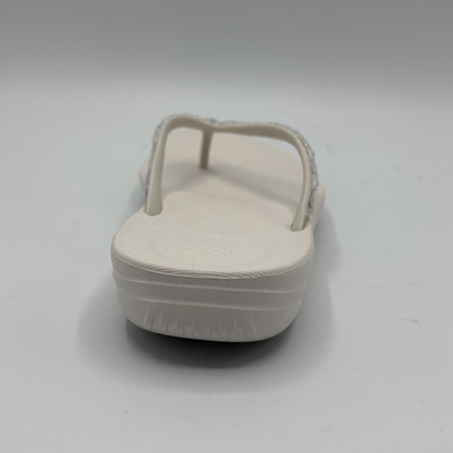 Beige sandal on a light gray background