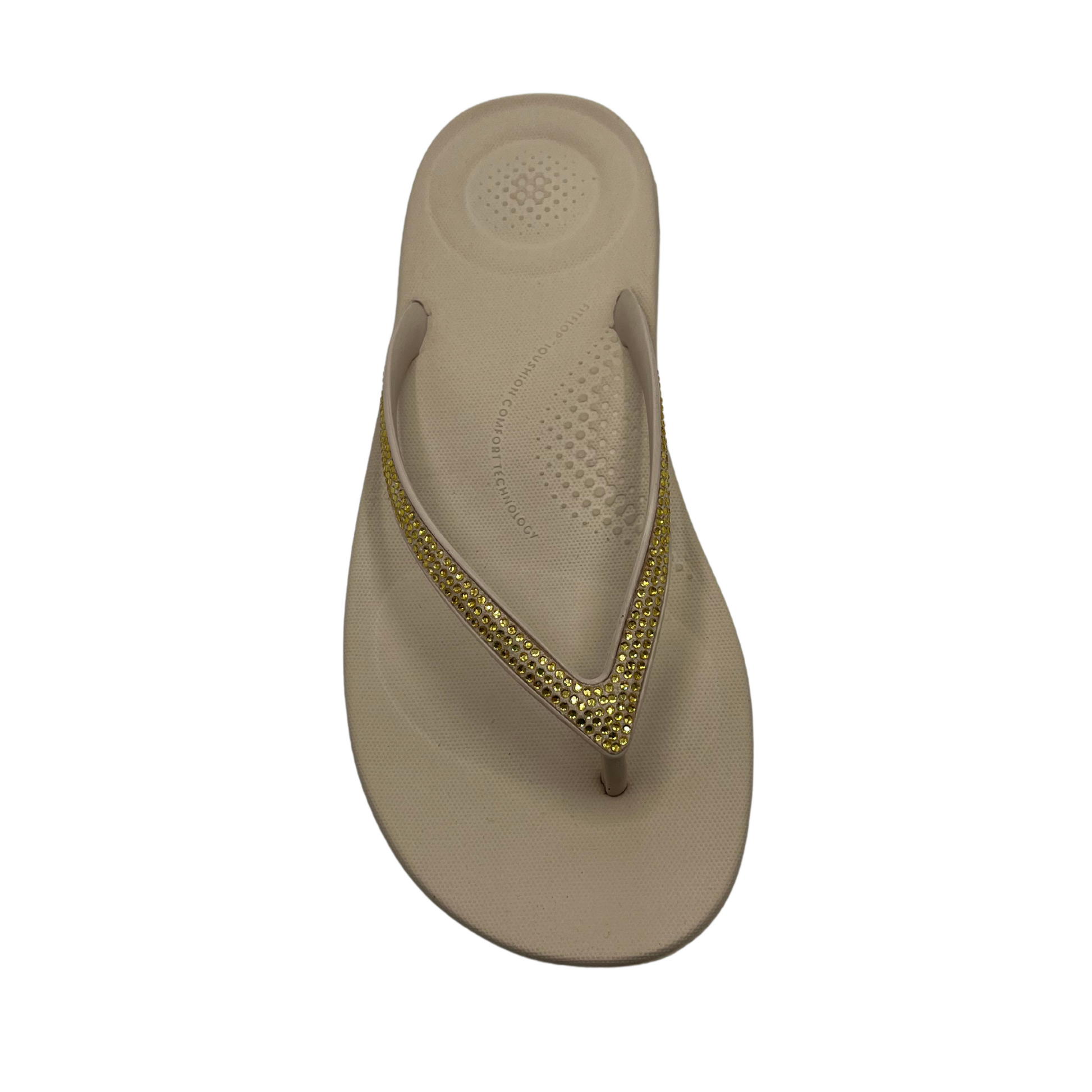 Top view of beige flip flop with bejewelled thong strap