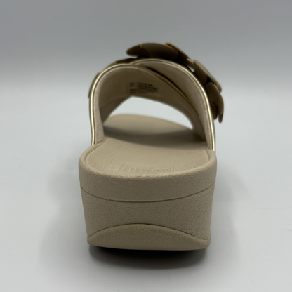 Beige sandal with a platform sole on a white background