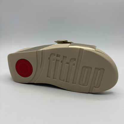 Beige sandal sole with 'fitflop' branding on a white background